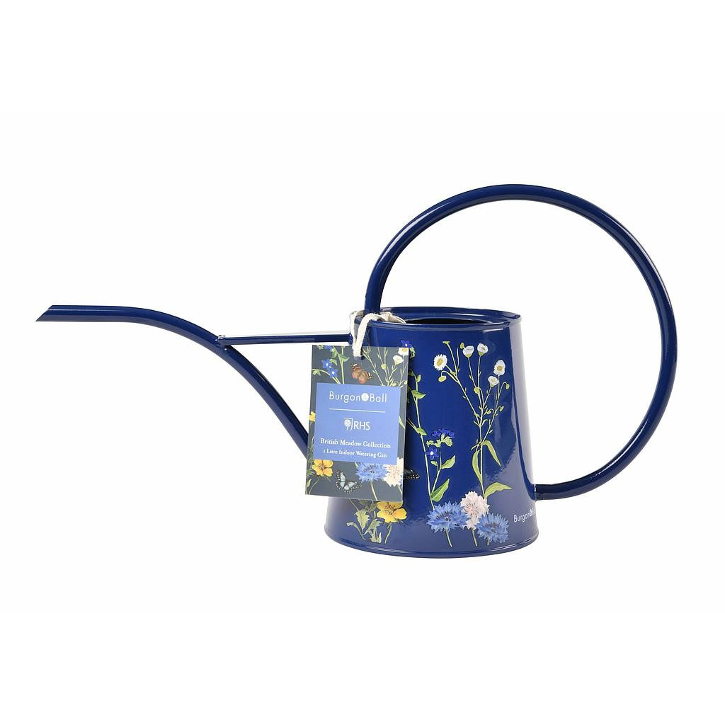 Blue watering can with floral design and tag on a white background