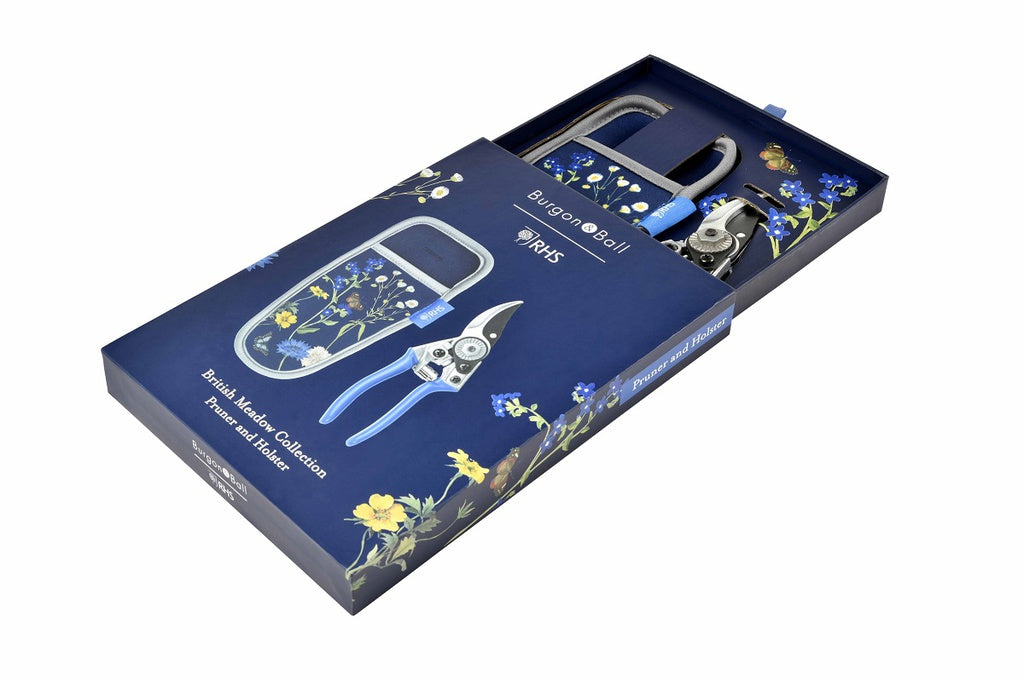 Blossom garden tool set with floral design packaging on a white background