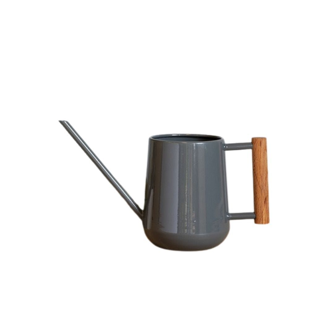 Gray watering can with a wooden handle on a white background