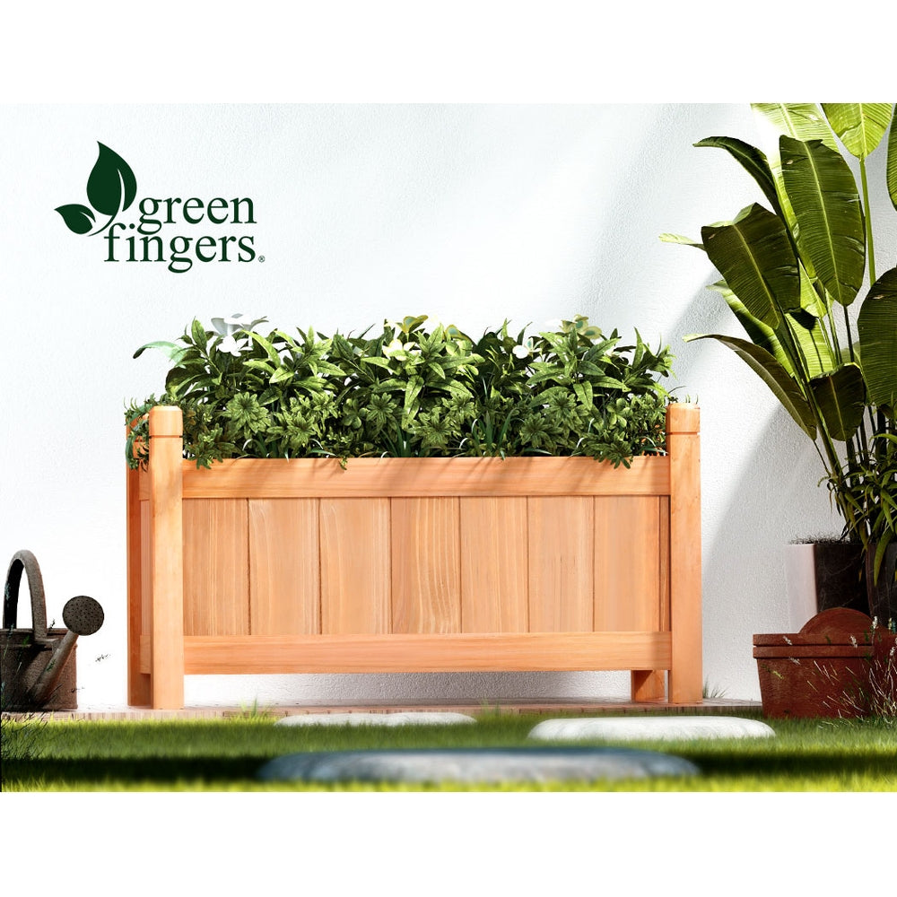 green fingers wooden planter box in courtyard