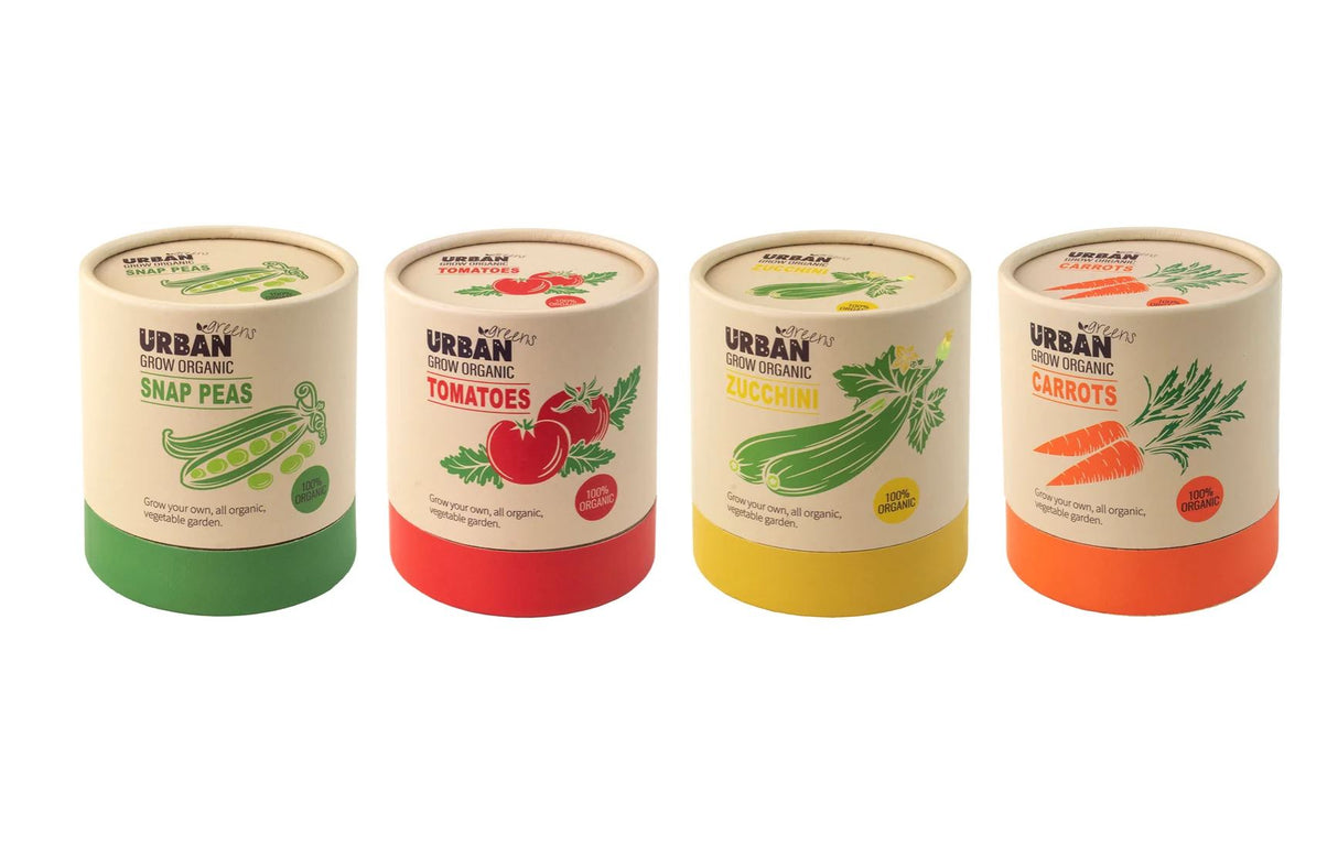 Four cylindrical containers labeled with vegetables on a white background