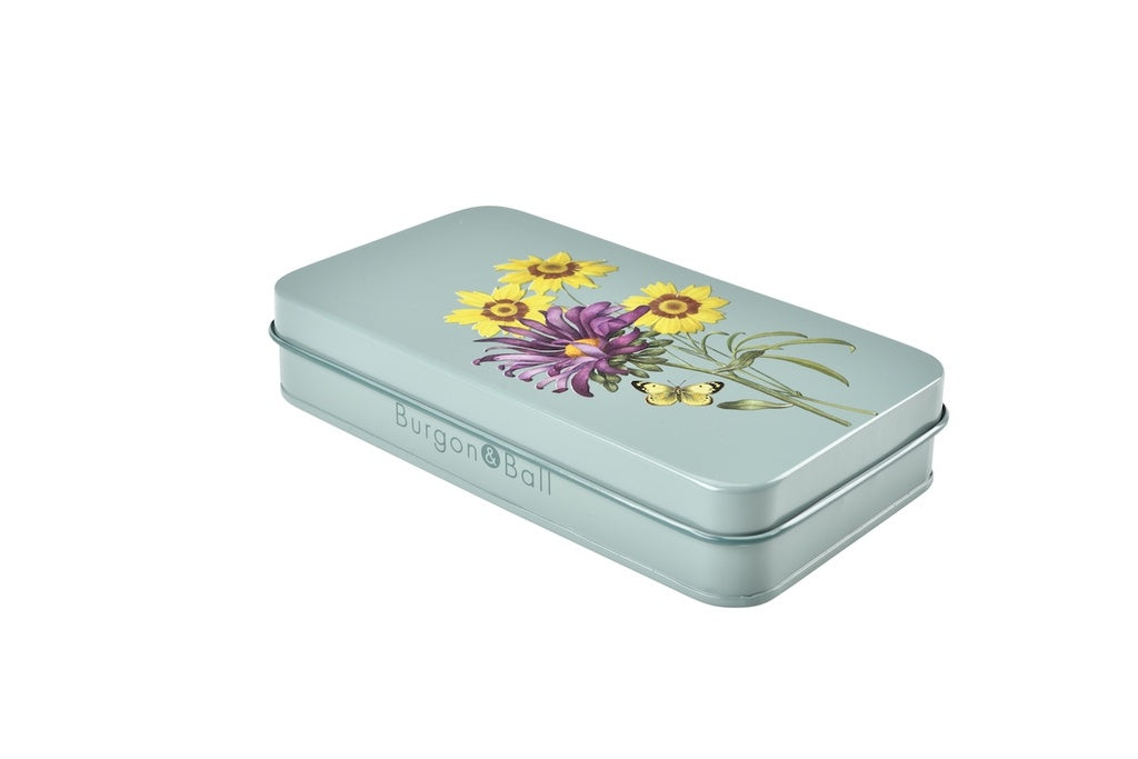 Tin box with floral design and 'Burgon & Ball' branding on a white background