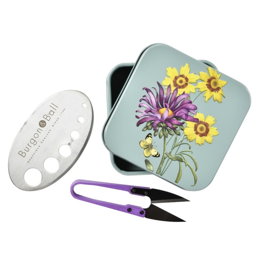 Burgon & Ball herb scissors with floral design tin on a white background