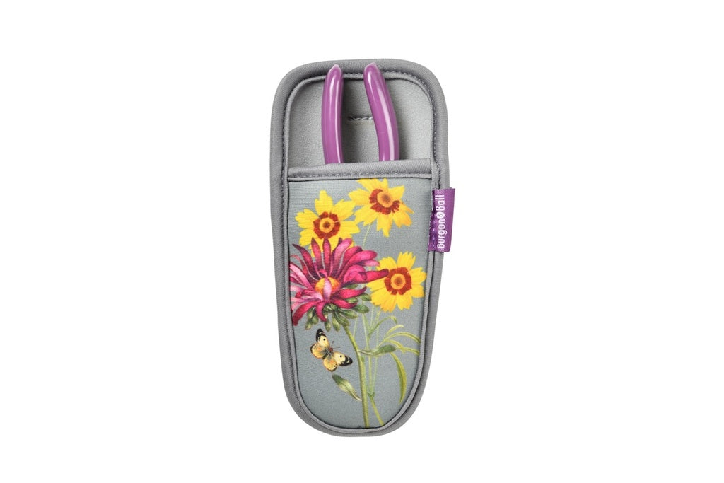 Gray holster with floral design and pink tool on a white background
