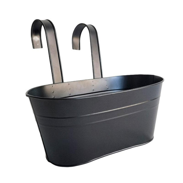 Black metal planter with handles on a white background