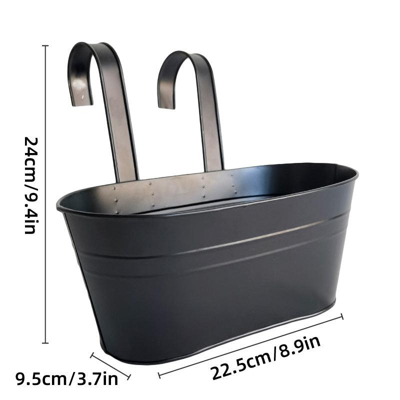 Black metal planter with hanging hooks and dimensions on a white background