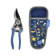 Gardening pruning scissors with a floral-patterned holster on a white background