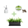 Collection of gardening items including a planter, plant mister, and seed balls on a white background