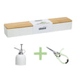 Gardening tools including a plant mister, snips, and a planter with microgreens on a white background.