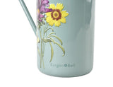 Light blue watering can with floral design and 'Burgon & Ball' branding.